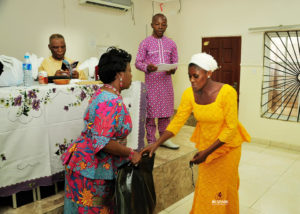 Prof. Mabel Aiyewumi PFiF Founding Mother handing out relief materials to our first set of Vulnerable beneficiaries at the official commissioning Ceremony-sa30/06/2018 in Abuja, Nigeria